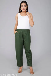 Green cotton solid trousers, comfortable with pleats, pockets, and elasticated back, suitable for casual wear or travel